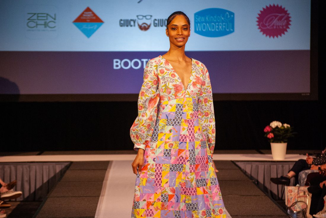 A flowing patchwork gown on the runway